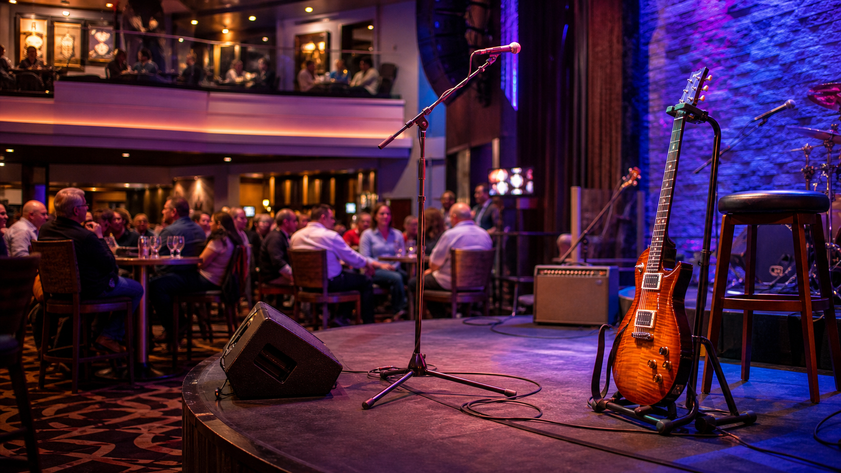 Tampa cafe music competition stage with guitar and microphone